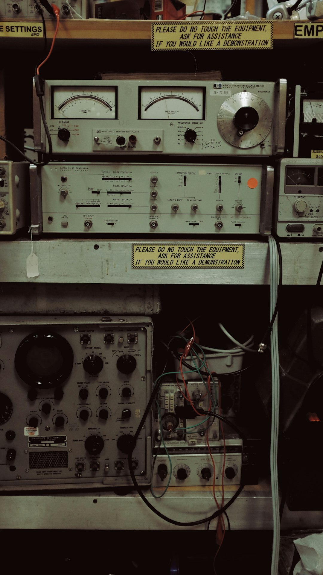 Vintage television studio control room with rows of analog monitors