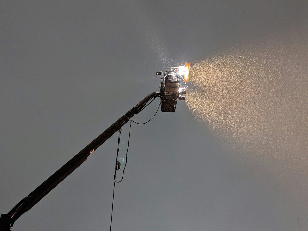 Professional broadcast television camera on a pedestal with studio lighting